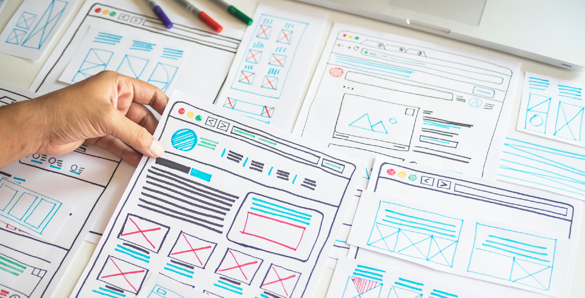 there are some papers on the desk for planning new website
